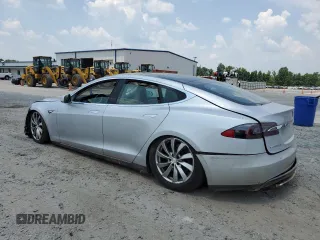 2013 Tesla Model S с VIN 5YJSA1DNXDFP04134, выставлен на аукционе Copart как лот 62660125 с пробегом 150 560 миль миль и Чистый • Clean title. История ставок и продаж доступна на DreamBid. Изображение 2.