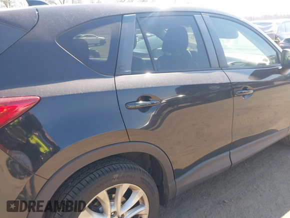 2014 Mazda CX-5 Grand Touring with VIN JM3KE4DY1E0339690, listed as a IAAI auction lot 41668780 with 216,825 mi miles. Bid and sale history available at carsss.com. Image 6.