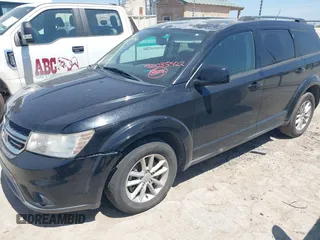 2015 Dodge Journey SXT with VIN 3C4PDCBB0FT708876, listed as a IAAI auction lot 42035422 with 157,669 mi miles. Bid and sale history available at carsss.com. Image 2.