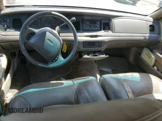 1999 Ford Crown Victoria LX z VIN 2FAFP74W1XX122364, wystawiony jako Copart lot #56929455 z przebiegiem 118 134 mil mil oraz Szkody całkowita. Historia ofert i sprzedaży dostępna na DreamBid. Obrazek 8.