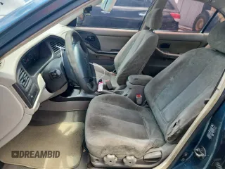 2001 Hyundai Elantra GLS z VIN KMHDN45D61U132398, wystawiony jako Copart lot #61164165 z przebiegiem 162 729 mil mil oraz Szkoda całkowita • Salvage title. Historia ofert i sprzedaży dostępna na DreamBid. Obrazek 7.