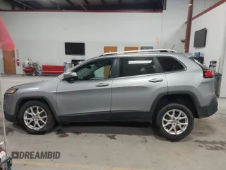 2016 Jeep Cherokee Altitude with VIN 1C4PJMCB6GW295404, listed as a IAAI auction lot 41211758 with 100,722 mi miles and . Bid and sale history available at DreamBid. Image 14.