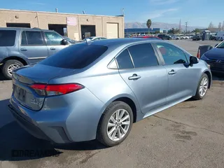 2023 Toyota Corolla Hybrid LE with VIN JTDBCMFEXP3006343, listed as a IAAI auction lot 41056503 with 121,690 mi miles. Bid and sale history available at carsss.com. Image 4.