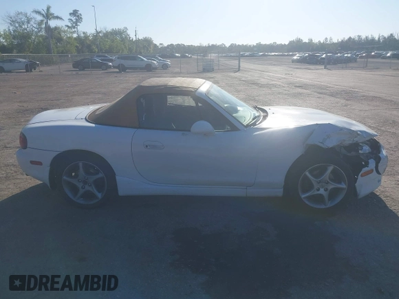 2003 Mazda MX-5 Miata Cloth z VIN JM1NB353730312566, wystawiony jako IAAI lot #41782864 z przebiegiem Nie podano mil oraz . Historia ofert i sprzedaży dostępna na DreamBid. Obrazek 13.