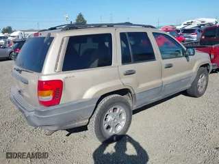 2001 Jeep Grand Cherokee Laredo with VIN 1J4GW48S11C519210, listed as a IAAI auction lot 42093631 with 211,024 mi miles. Bid and sale history available at carsss.com. Image 4.