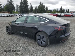 2019 Tesla Model 3 Mid Range z VIN 5YJ3E1EA2KF361787, wystawiony jako Copart lot #56059465 z przebiegiem 50 186 mil mil oraz Szkody całkowita. Historia ofert i sprzedaży dostępna na DreamBid. Obrazek 2.