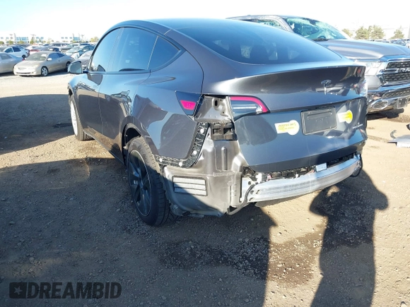 2021 Tesla Model Y Long Range with VIN 5YJYGDEE5MF191142, listed as a IAAI auction lot 41448514 with 71,626 mi miles. Bid and sale history available at carsss.com. Image 3.