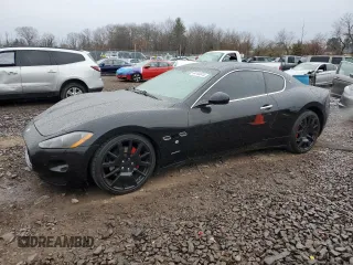 2009 Maserati GranTurismo с VIN ZAMGJ45A990044267, выставлен на аукционе Copart как лот 84144674 с пробегом 63 178 миль миль и Списание • Salvage title. История ставок и продаж доступна на DreamBid. Изображение 1.