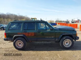 1996 Jeep Cherokee Sport with VIN 1J4FJ68S2TL299150, listed as a IAAI auction lot 41932867 with 142,761 mi miles. Bid and sale history available at carsss.com. Image 13.