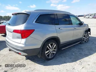 2017 Honda Pilot Touring with VIN 5FNYF6H94HB006873, listed as a IAAI auction lot 41618529 with 154,689 mi miles. Bid and sale history available at carsss.com. Image 4.