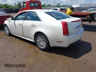 2012 Cadillac CTS Luxury with VIN 1G6DG5E57C0137409, listed as a IAAI auction lot 42633890 with 86,886 mi miles and . Bid and sale history available at DreamBid. Image 3.