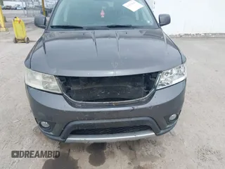 2014 Dodge Journey SXT z VIN 3C4PDDBG2ET161528, wystawiony jako IAAI lot #41932649 z przebiegiem 161 597 mil mil oraz . Historia ofert i sprzedaży dostępna na DreamBid. Obrazek 6.