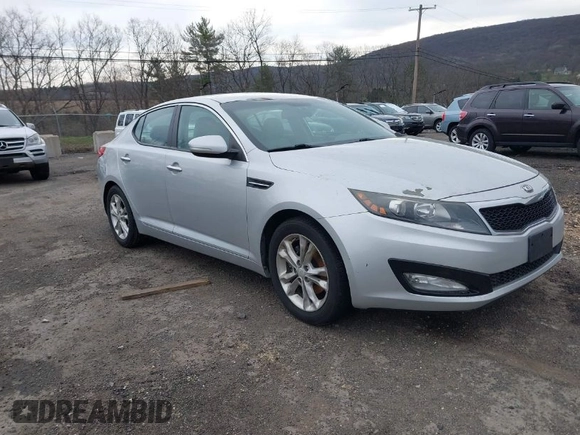 2013 Kia Optima LX with VIN 5XXGM4A74DG129353, listed as a IAAI auction lot 42035909 with 140,315 mi miles. Bid and sale history available at carsss.com. Image 1.