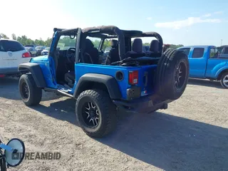 2015 Jeep Wrangler Sport z VIN 1C4AJWAG8FL550859, wystawiony jako IAAI lot #42154946 z przebiegiem 143 658 mil mil oraz . Historia ofert i sprzedaży dostępna na DreamBid. Obrazek 3.