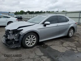 2018 Toyota Camry LE с VIN 4T1B11HK4JU670836, выставлен на аукционе Copart как лот 60277465 с пробегом 102 135 миль миль и Списание • Salvage title. История ставок и продаж доступна на DreamBid. Изображение 1.