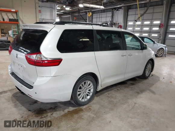 2015 Toyota Sienna XLE with VIN 5TDYK3DC8FS598525, listed as a IAAI auction lot 41918825 with 128,557 mi miles. Bid and sale history available at carsss.com. Image 4.