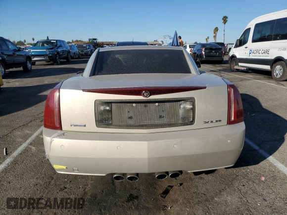 2006 Cadillac XLR z VIN 1G6YV36AX65603770, wystawiony jako Copart lot #81527954 z przebiegiem 59 498 mil mil oraz Szkody całkowita. Historia ofert i sprzedaży dostępna na DreamBid. Obrazek 6.