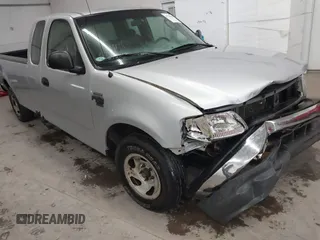 2002 Ford F-150 XL with VIN 1FTRX17W52NB23883, listed as a IAAI auction lot 41721680 with 144,115 mi miles. Bid and sale history available at carsss.com. Image 6.