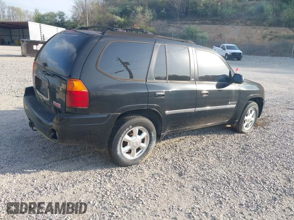 2006 GMC Envoy SLE with VIN 1GKDT13S262204960, listed as a IAAI auction lot 42045236 with 183,338 mi miles. Bid and sale history available at carsss.com. Image 4.