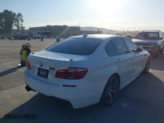 2014 BMW M5 with VIN WBSFV9C55ED593614, listed as a IAAI auction lot 41777369 with 144,076 mi miles. Bid and sale history available at carsss.com. Image 4.