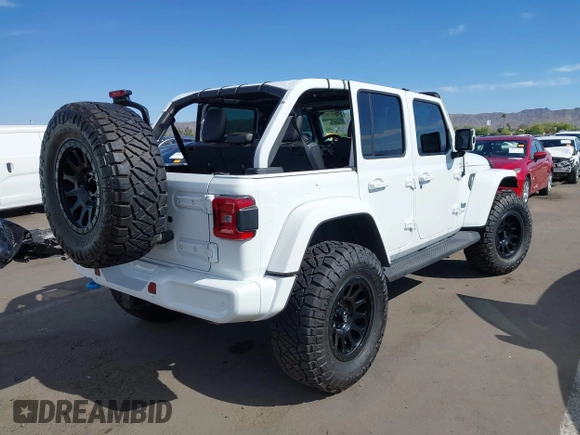 2021 Jeep Wrangler Unlimited Sahara with VIN 1C4JJXP63MW716690, listed as a IAAI auction lot 42087879 with 40,889 mi miles and . Bid and sale history available at DreamBid. Image 4.