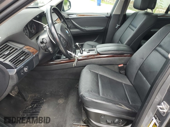 2012 BMW X5 35i with VIN 5UXZV4C50CL991452, listed as a Copart auction lot 56890265 with 147,019 mi miles and Salvage title. Bid and sale history available at DreamBid. Image 7.
