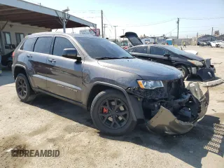 2018 Jeep Grand Cherokee Laredo E with VIN 1C4RJEAG9JC397382, listed as a Copart auction lot 56550815 with 72,239 mi miles and Salvage title. Bid and sale history available at DreamBid. Image 4.