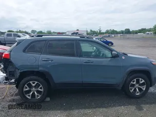 2014 Jeep Cherokee Trailhawk z VIN 1C4PJMBS4EW236950, wystawiony jako IAAI lot #42636128 z przebiegiem 170 491 mil mil oraz . Historia ofert i sprzedaży dostępna na DreamBid. Obrazek 14.