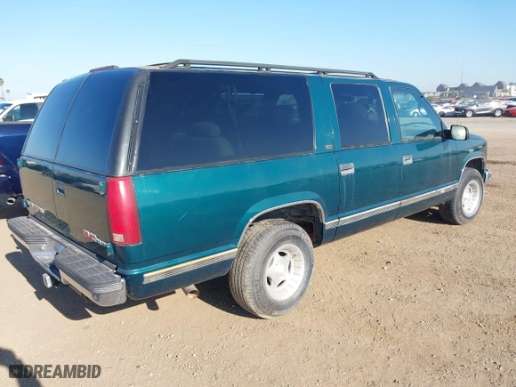 1996 GMC Suburban with VIN 1GDEC16R5TJ742543, listed as a IAAI auction lot 41910103 with 159,469 mi miles. Bid and sale history available at carsss.com. Image 4.