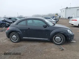 2012 Volkswagen Beetle 2.5L PZEV with VIN 3VWJP7AT0CM628169, listed as a IAAI auction lot 41628754 with 64,770 mi miles. Bid and sale history available at carsss.com. Image 6.