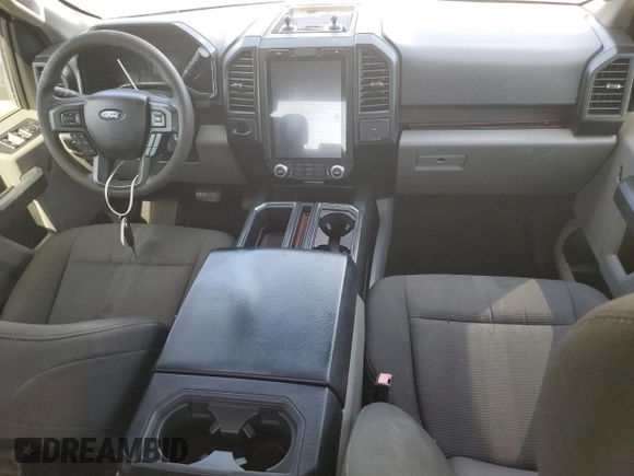 2018 Ford F-150 XL with VIN 1FTEW1CPXJKF27567, listed as a Copart auction lot 63034034 with 125,508 mi miles and Salvage title. Bid and sale history available at DreamBid. Image 8.