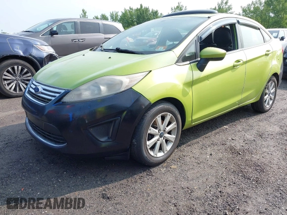 2011 Ford Fiesta SE z VIN 3FADP4BJ7BM122774, wystawiony jako IAAI lot #42392327 z przebiegiem 174 764 mil mil oraz . Historia ofert i sprzedaży dostępna na DreamBid. Obrazek 2.