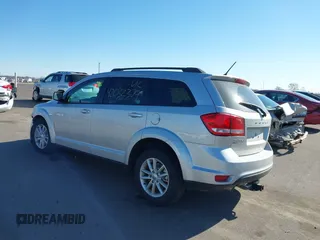2013 Dodge Journey SXT with VIN 3C4PDDBG4DT506900, listed as a IAAI auction lot 42032379 with 130,911 mi miles and . Bid and sale history available at DreamBid. Image 3.