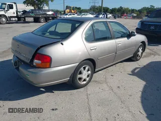 1999 Nissan Altima XE with VIN 1N4DL01D1XC255927, listed as a IAAI auction lot 42003101 with 154,000 mi miles. Bid and sale history available at carsss.com. Image 4.