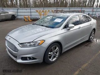 2015 Ford Fusion Titanium Hybrid with VIN 3FA6P0RU8FR181312, listed as a IAAI auction lot 42071584 with 99,955 mi miles. Bid and sale history available at carsss.com. Image 2.