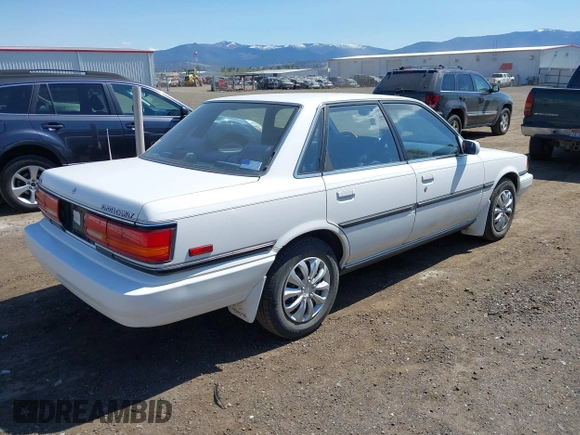 1990 Toyota Camry LE ECT z VIN JT2SV22E1L3427911, wystawiony jako IAAI lot #42040646 z przebiegiem 133 129 mil mil oraz . Historia ofert i sprzedaży dostępna na DreamBid. Obrazek 4.
