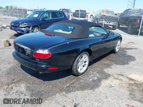 2002 Jaguar XK with VIN SAJDA42C12NA30499, listed as a IAAI auction lot 41954577 with 77,152 mi miles and . Bid and sale history available at DreamBid. Image 4.