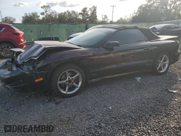 1999 Pontiac Firebird Trans Am with VIN 2G2FV32G1X2217352, listed as a Copart auction lot 79941714 with 174,580 mi miles and Salvage title. Bid and sale history available at DreamBid. Image 1.