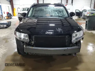 2016 Jeep Compass Latitude with VIN 1C4NJDEB2GD573909, listed as a Copart auction lot 62168225 with 70,944 mi miles and Salvage title. Bid and sale history available at DreamBid. Image 5.