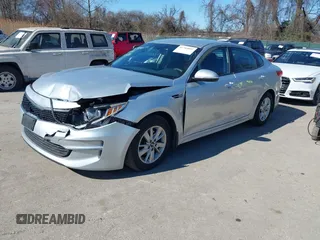 2016 Kia Optima LX with VIN 5XXGT4L37GG084538, listed as a IAAI auction lot 41784807 with 128,928 mi miles. Bid and sale history available at carsss.com. Image 2.