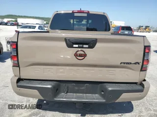 2023 Nissan Frontier Pro-4X with VIN 1N6ED1EK0PN668109, listed as a Copart auction lot 57064975 with 6,406 mi miles and Salvage title. Bid and sale history available at DreamBid. Image 6.