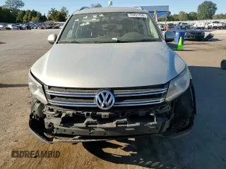 2014 Volkswagen Tiguan SE with VIN WVGAV3AX9EW611860, listed as a Copart auction lot 74431754 with 116,022 mi miles and Salvage title. Bid and sale history available at DreamBid. Image 12.