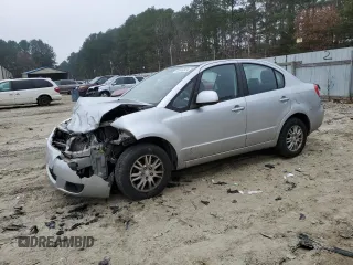 2012 Suzuki SX4 LE with VIN JS2YC5A39C6305357, listed as a Copart auction lot 84146324 with 163,097 mi miles and Salvage Title. Bid and sale history available at carsss.com. Image 1.