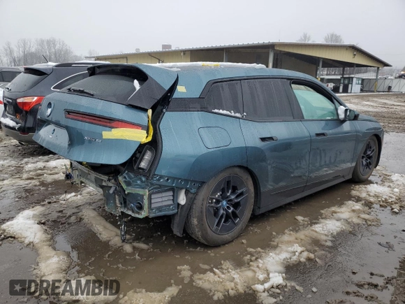 2023 BMW iX xDrive50 with VIN WB523CF02PCM42677, listed as a Copart auction lot 83855194 with 17,025 mi miles and Salvage Title. Bid and sale history available at carsss.com. Image 3.