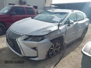 2019 Lexus RX with VIN 2T2ZZMCA3KC135292, listed as a IAAI auction lot 41573153 with 106,971 mi miles. Bid and sale history available at carsss.com. Image 2.