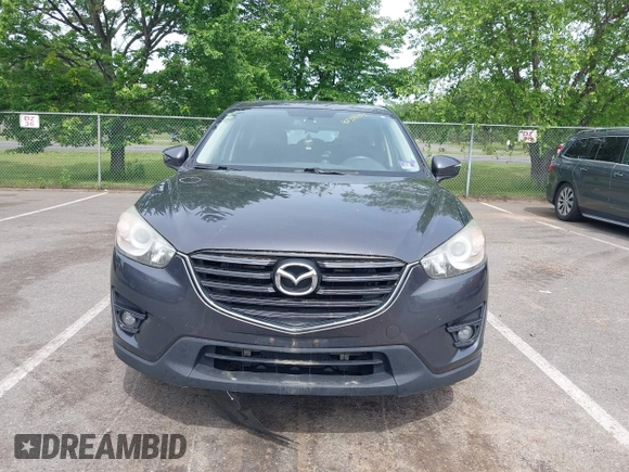 2016 Mazda CX-5 Touring z VIN JM3KE4CY4G0692655, wystawiony jako IAAI lot #42318657 z przebiegiem 212 826 mil mil oraz . Historia ofert i sprzedaży dostępna na DreamBid. Obrazek 12.