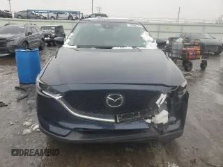 2021 Mazda CX-5 Grand Touring with VIN JM3KFBDM0M0391325, listed as a Copart auction lot 44863215 with 21,997 mi miles and Salvage Title. Bid and sale history available at DreamBid. Image 5.