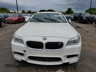 2016 BMW M5 z VIN WBSFV9C52GG343300, wystawiony jako Copart lot #49419563 z przebiegiem 39 217 mil mil oraz . Historia ofert i sprzedaży dostępna na DreamBid. Obrazek 5.