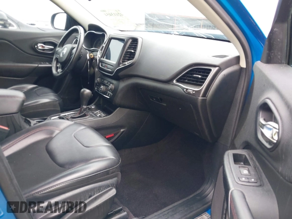 2019 Jeep Cherokee Trailhawk with VIN 1C4PJMBX0KD141577, listed as a IAAI auction lot 42413454 with 122,386 mi miles and . Bid and sale history available at DreamBid. Image 5.