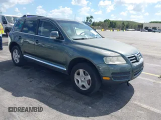 2005 Volkswagen Touareg 3.2L V6 with VIN WVGZG77L15D018899, listed as a IAAI auction lot 41572432 with 165,678 mi miles and . Bid and sale history available at DreamBid. Image 1.